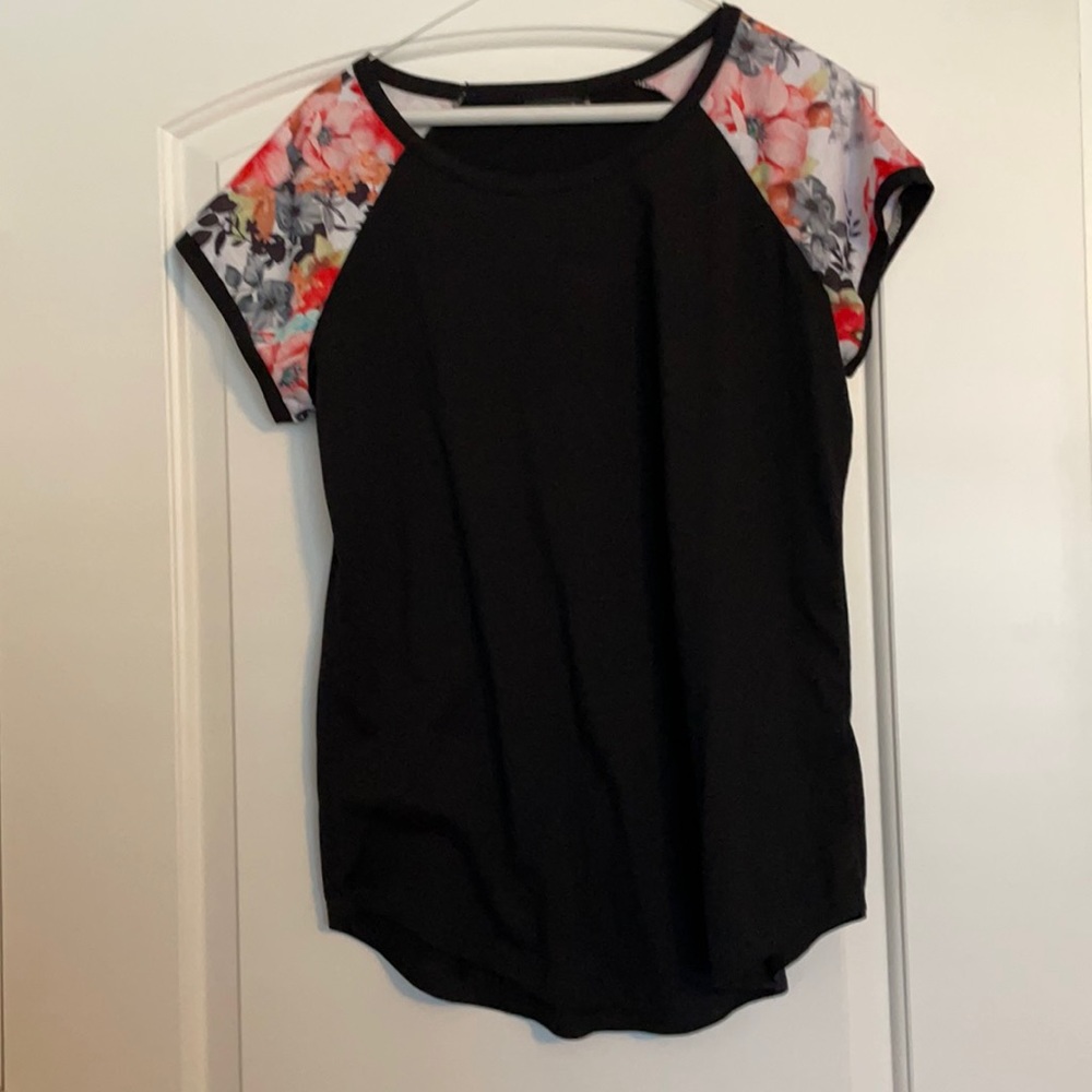 A medium black Zawapemia shirt with floral sleeves